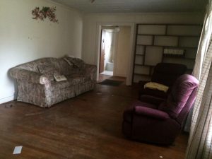 fixer upper home before picture-living room