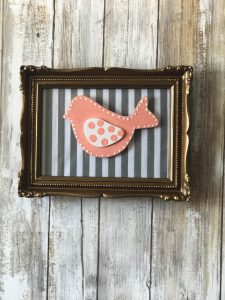 Thrift Store frame with fabric with bird attachment that can be changed with the seasons!
