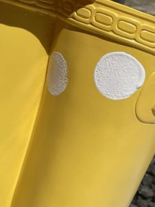 yellow rubber boot flower planter from big lots painting on white polka dots