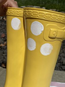 yellow rubber boot flower planter from big lots painting on white polka dots